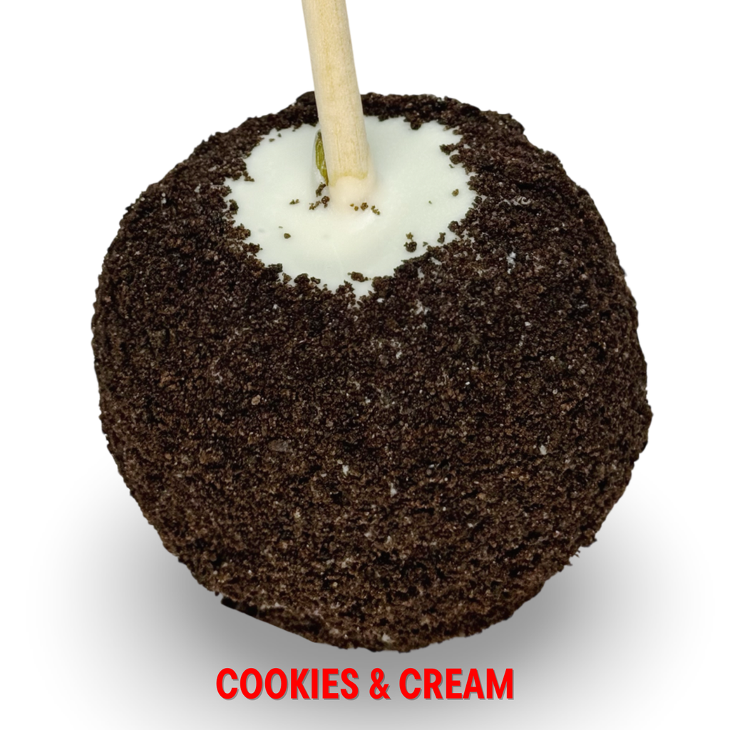 White chocolate caramel apple with Oreo crumble topping on white background.