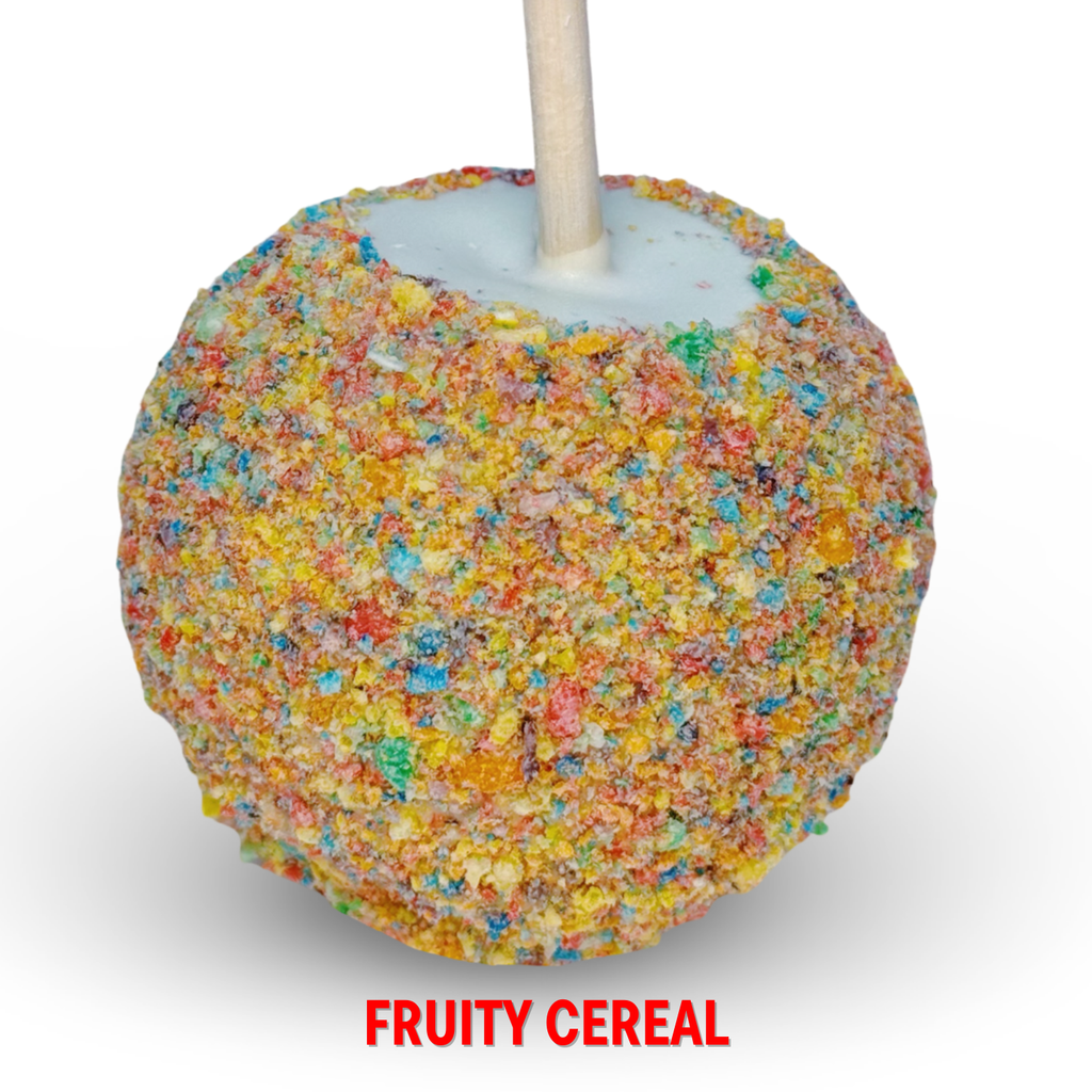 White chocolate caramel apple with fruity cereal crumble topping on white background.